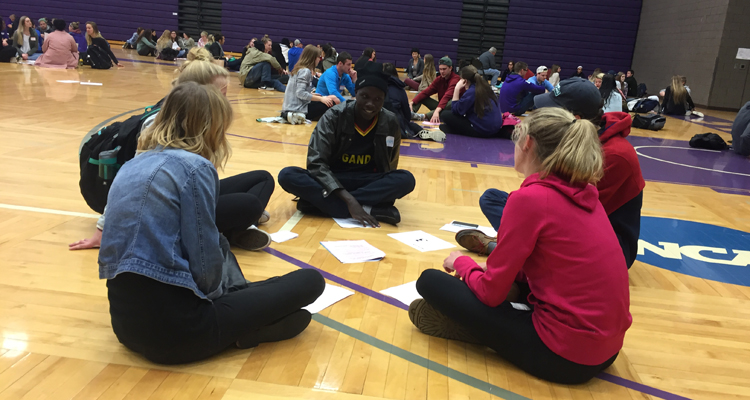Students talk in their small groups at the World Cafe event. (Photo provided)