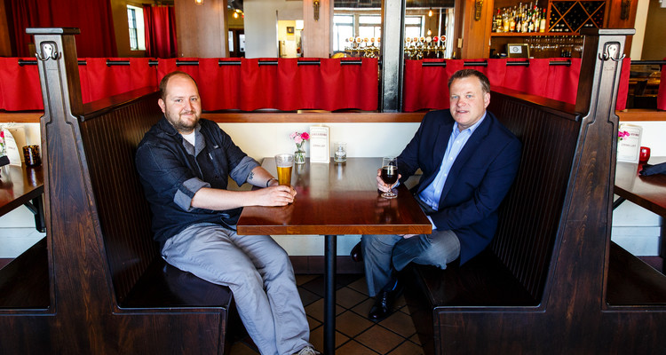 Chris Ikeda (Entrepreneurship), left, chef and owner of Lake & Irving Restaurant & Bar, and Reid Hellgren ('97, MBA), former partner in Parella, pose for a portrait at Lake & Irving in Minneapolis on May 18, 2016.