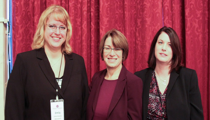 Masters in Social Work alumni Emily Alewine '08 (left) and Rachel Wolstand '93 stand with Sen. Amy Klobuchar in Washington D.C.