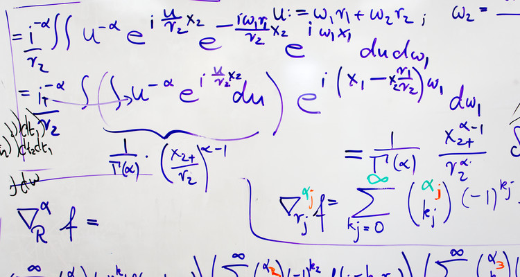 A white board covered with a lengthy math equation in the office of Department of Mathematics Chair and Professor Patrick Van Fleet in O'Shaughnessy Science Hall. Van Fleet was working on an equation that is used for computer image modeling. Photo by Mark Brown.