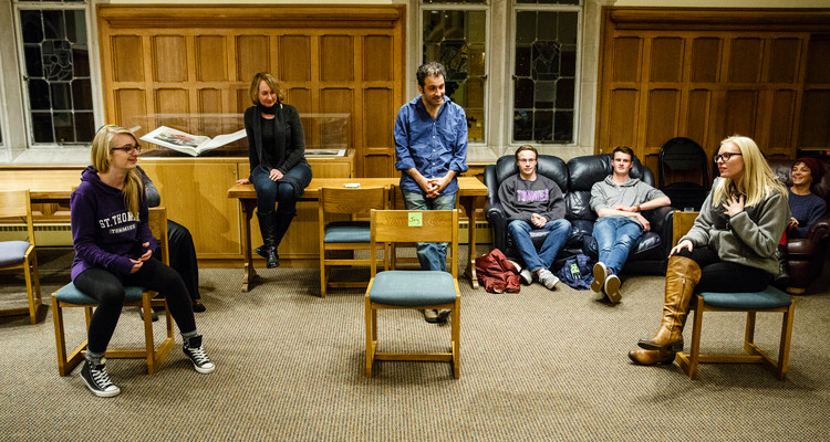 Students act in an improv exercise during an English class in the Leather Room in the O'Shaughnessy-Frey Library Center on Oct. 28, 2015. Members of the Wonderlust Theater participated in a residency on campus with several different classes and programs, working with English and Theater students on improvisation skills and script writing. English professor Amy Muse, back right, and Wonderlust Theater co-Artistic Director Alan Berks, middle back (wearing blue shirt) look on. Photos by Mark Brown.