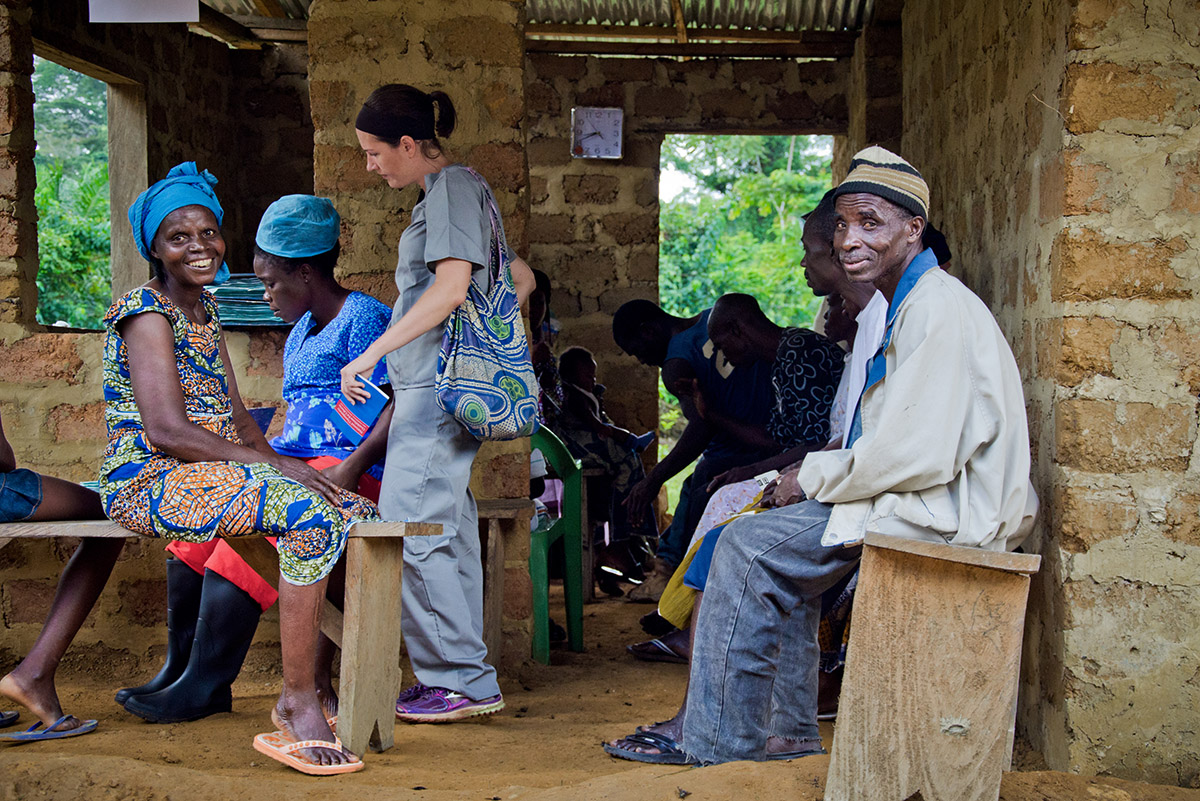 Patients wait at an outreach clinic provided by Last Mile Health and a county health team in the remote community of Boe-Geewon.