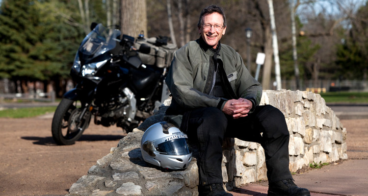 University Relations Director of News Services Jim Winterer and avid motorcyclist poses for a photograph near South Mississippi River Boulevard in Saint, Paul, Minn., on Friday, April 9, 2010. Winterer is photographed for the "How We Work, How We Play" section of the Spring 2010 edition of St. Thomas Magazine.