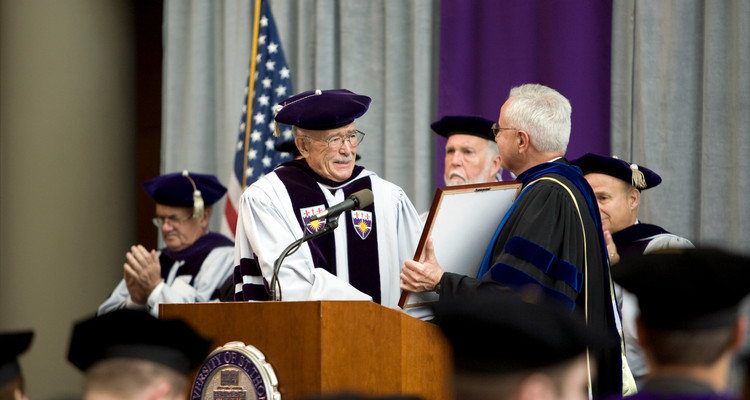 University president Father Dennis Dease, right, awards Guy Schoenecker the Thomas Aquinas Medallion during the University of St. Thomas School of Law Commencement at the School of Law in Minneapolis, Minn., on Saturday, May 9, 2009.