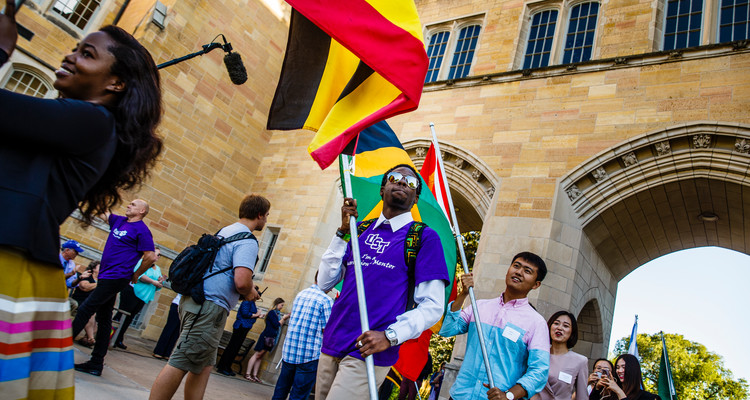 International students carry their flags through the Arches during the March Through the Arches event September 8, 2016.