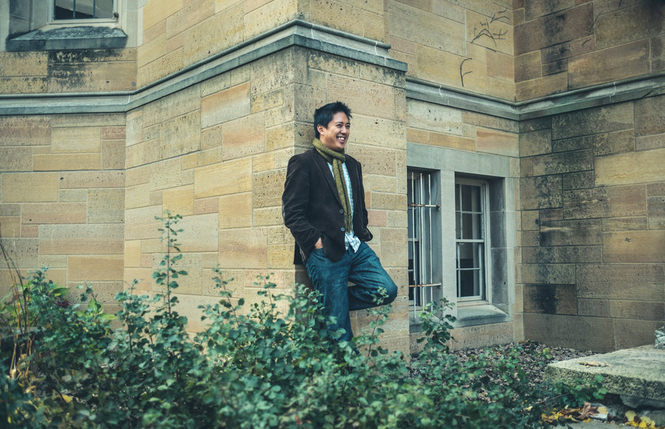 English professor Chris Santiago poses for a portrait outside O'Shaughnessy-Frey Library November 2, 2016.