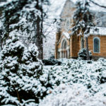 St. Mary's Chapel is seen through snow-covered trees.