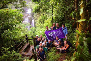 First place, Tommies Abroad: Nick Hable, Costa Rica. "Hidden Oasis in the Costa Rican Jungle: This photo shows our biology study abroad group holding the St. Thomas flag with a pristine waterfall in the background. This was in the middle of the Costa Rican jungle, next to Rara Avis, and we came across this after our four-hour hike into the jungle. This remote location is virtually untouched by humans, has a livelihood of animals and indigenous plants, and has little access to water and electricity. This location showed how simple life can be and it also changed our perspectives on how we view society in the United States."