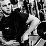 Reid straps on the weighted vest that has become a core feature of his workouts.