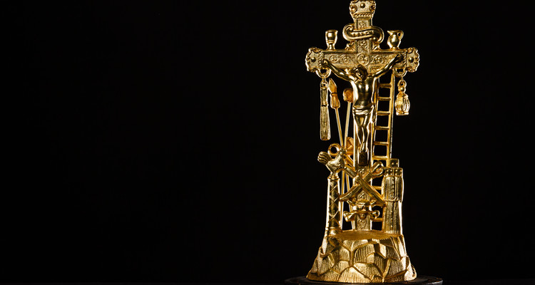 A gold crucifix from the collection of Fr. Dennis Dease is show March13, 2015. Art History tag number 2012.003.006A