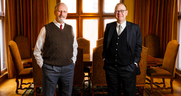 Catholic Studies professor Robert (Bob) Kennedy (left) and John Boyle pose for a portrait in Sitzmann Hall February 24, 2017.