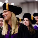 A School of Law student laughs during the School of Law Commencement ceremony May 13, 2017 at the Minneapolis Hilton.