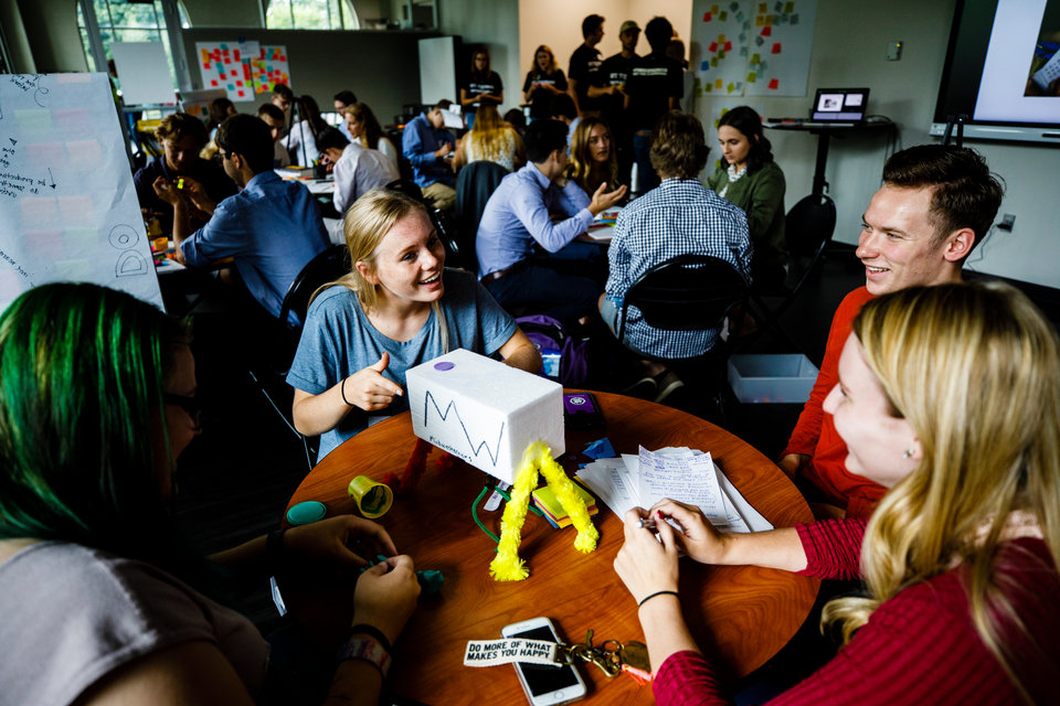 Students work together on a prototype during an Opus College of Business "freshman innovation immersion" session August 30, 2017 in the Anderson Student Center's creative space (maker space). During the two-day program, incoming students work in groups to solve a given problem with entrepreneurial business techniques.