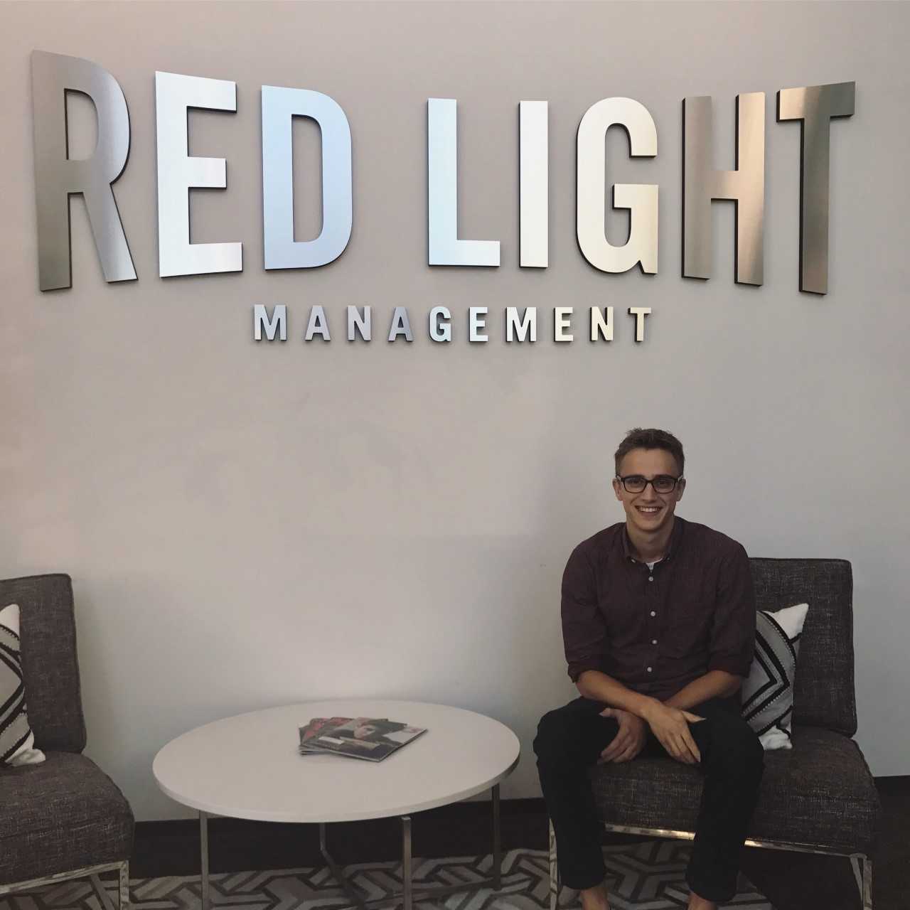 Alex Heimerman poses for a photo at Red Light Management, where he had his Nashville internship this summer.
