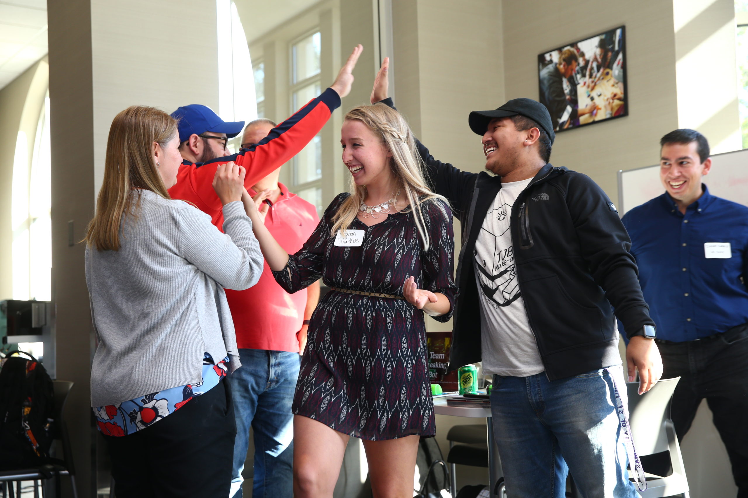 Sophomore Megan Sharkus (center) celebrates with her teammates after they're announced the winner of the US Bank Make-a-Thon.