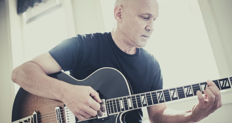 Guitar studies faculty Chris Kachian plays in the studio September 20, 2016.