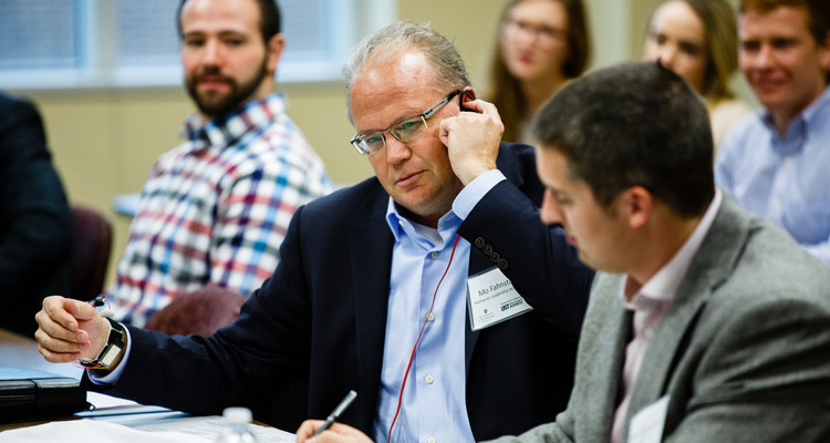 Judge Maurice (Mo) Fahnestock tries out the "Elate" menu reading system during the Fowler Business Concept Challenge November 20, 2015 in Schulze Hall. The competition sees students auditioning their ideas for a business in front of panels of judges with the hopes of winning the $10,000 first prize.