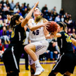 Kaitlin Langer puts up a shot during the women's basketball MIAC Championship game in February.