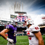 Grant Slavik (81) stands with Saint John's player Trevor Dittberner following the Tommie Johnnie football game at Target Field in Minneapolis on September 23, 2017.