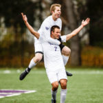 Christian Elliehausen celebrates a goal with teammate Pierce Erickson on his back during the MIAC Championship soccer game against Macalester.