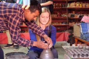 Third place, Global Classroom: Bryjett Nordmark, Bhaktapur, Nepal. “The Potter and The Clay: A local potter helps me form a clay cup in Potter's Square. He is helping shape the clay into a work of art and helping shape the mind to open up to new ways of thinking during an experience one can only have by studying abroad."