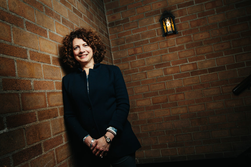 Katherine Boosalis ('81 B.A., Economics and '87 MBA) poses for a photo in Aquinas Hall on December 7, 2017, in St. Paul.
