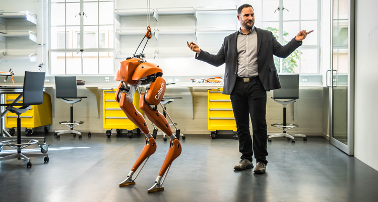 Aaron Ames '01 with robot CASSIE. (Photo provided by Caltech)