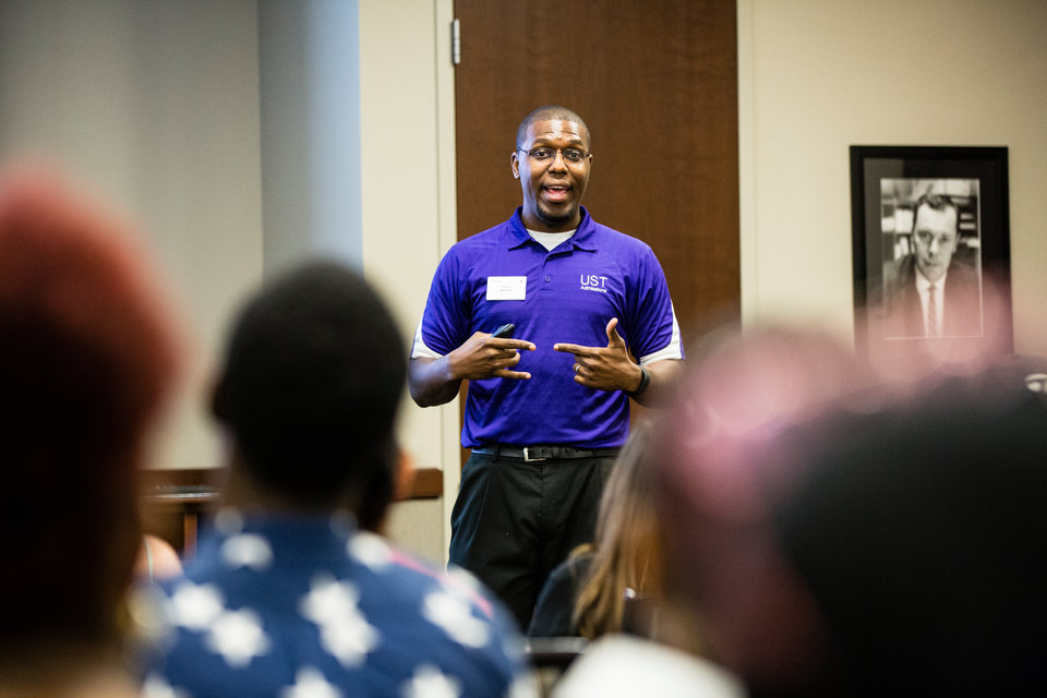 Teron Buford, Assistant Director of Admissions, Coordinator of Multicultural Recruitment, speaks to DFC students in the Anderson Student Center during a Dougherty Family College Info Session tour on July 27, 2017 in St. Paul. Students committed to attending the DFC, along with family and friends, learned about the program and campus facilities.