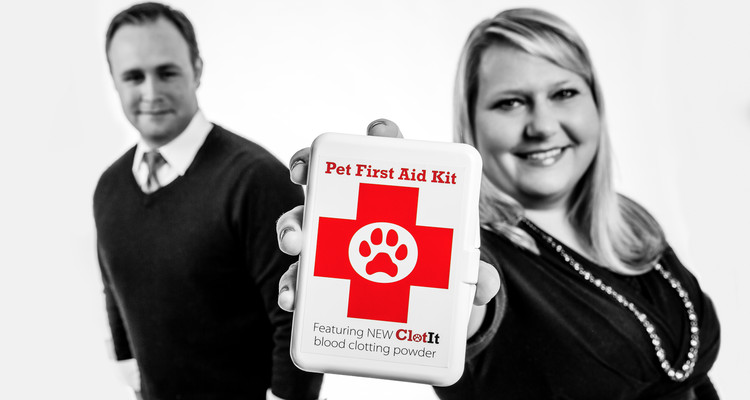 St. Thomas Opus College of Business alums Michael and Susie Wuollett '11 pose for a studio portrait July 8, 2014 with ClotIt, a product they developed to help blood clot faster. The powder is currently used in veterinary applications and the two are hoping to start human trials soon.