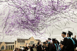 Confetti flies over students during the 2018 Graduate Commencement ceremony in O'Shaughnessy Stadium on May 18, 2018 in St. Paul.