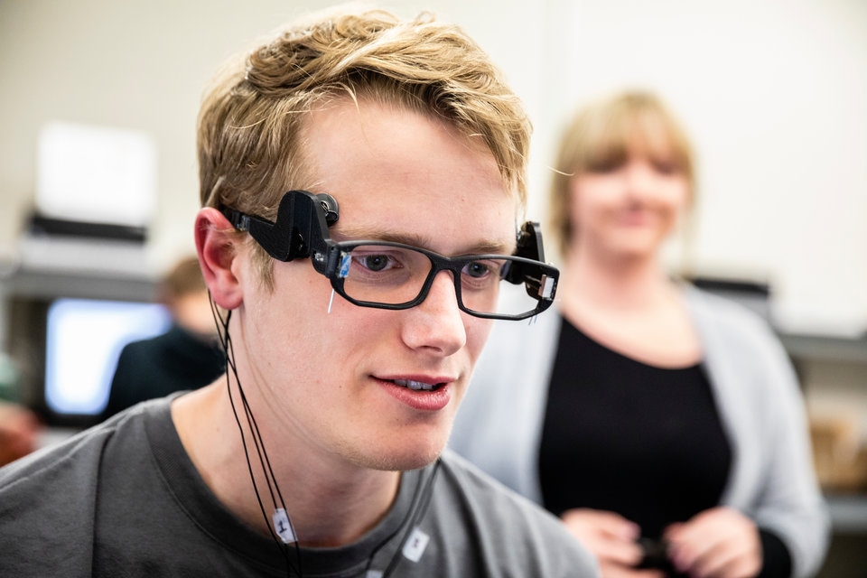 Michael VanDeVoorde wears an EEG sensor, part of his team's senior design challenge working with Medibotics.