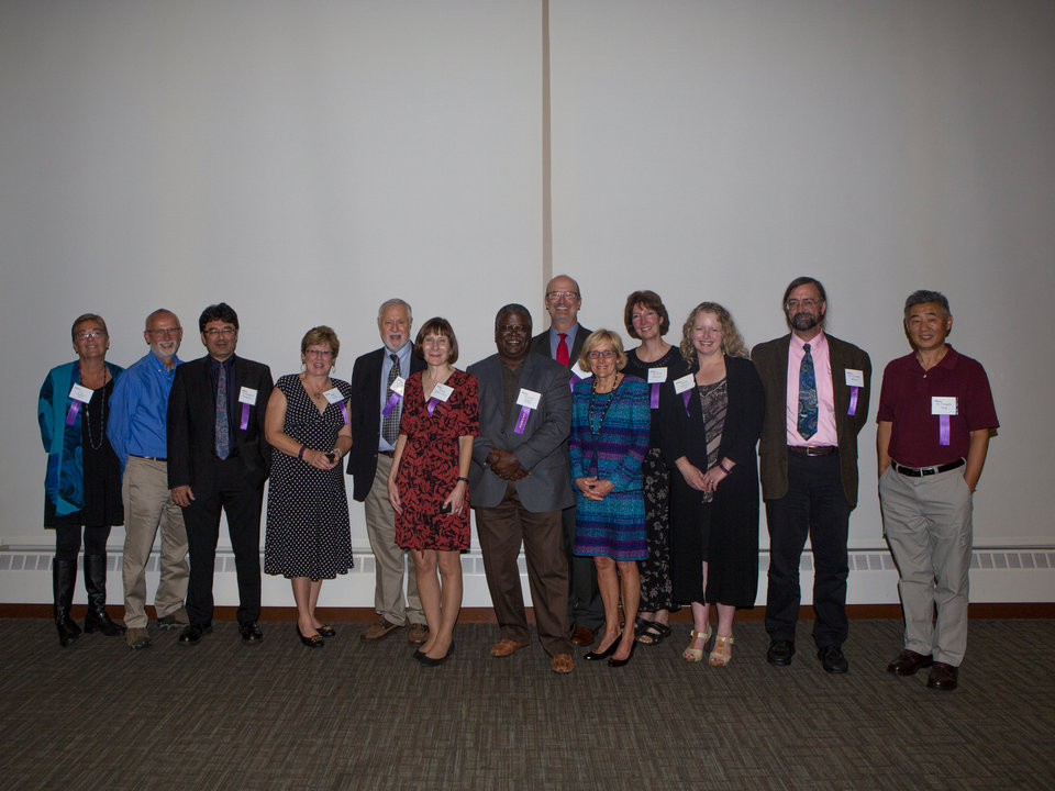 Staff and faculty pose for a picture with President Julie Sullivan at the annual dinner for faculty and staff who have worked at St. Thomas for 25 years or more in Woulfe on Wednesday, September 19, 2018.