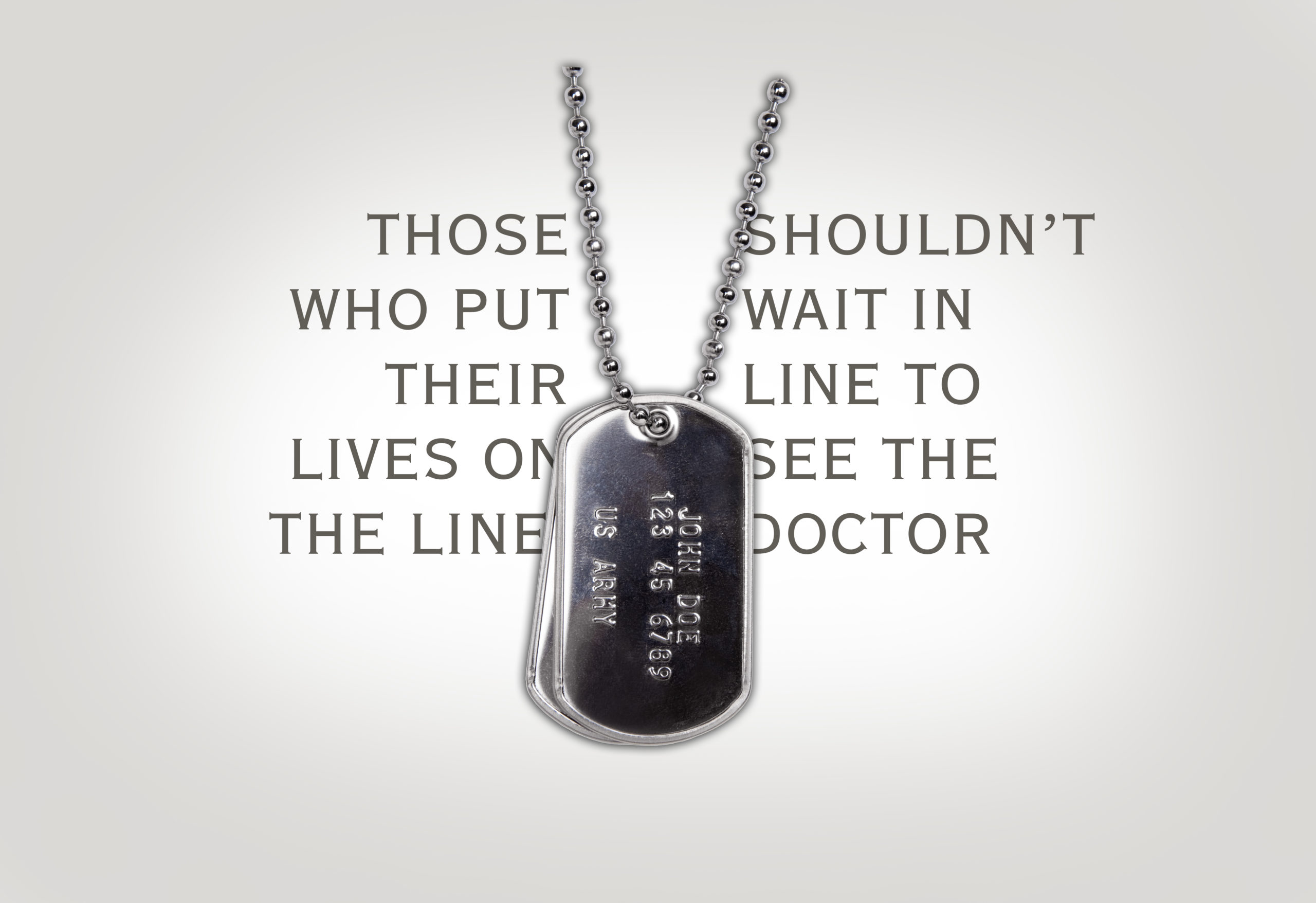 US Army dog tags with a fictitious name and number on them isolated on white.