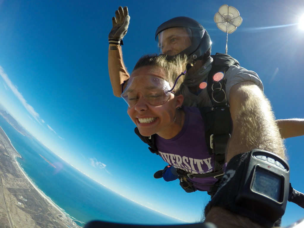 This was one of the best experiences of my life! A group of us from Semester at Sea planned this skydiving trip before the semester even started. This was my first time skydiving but it has been at the top of my bucket list for as long as I can remember. I wanted to represent my college as I skydived so I wore my University of St. Thomas shirt. It was an experience like no other. This photo captured my genuine excitement for what it feels like to be freefalling and traveling around the world.