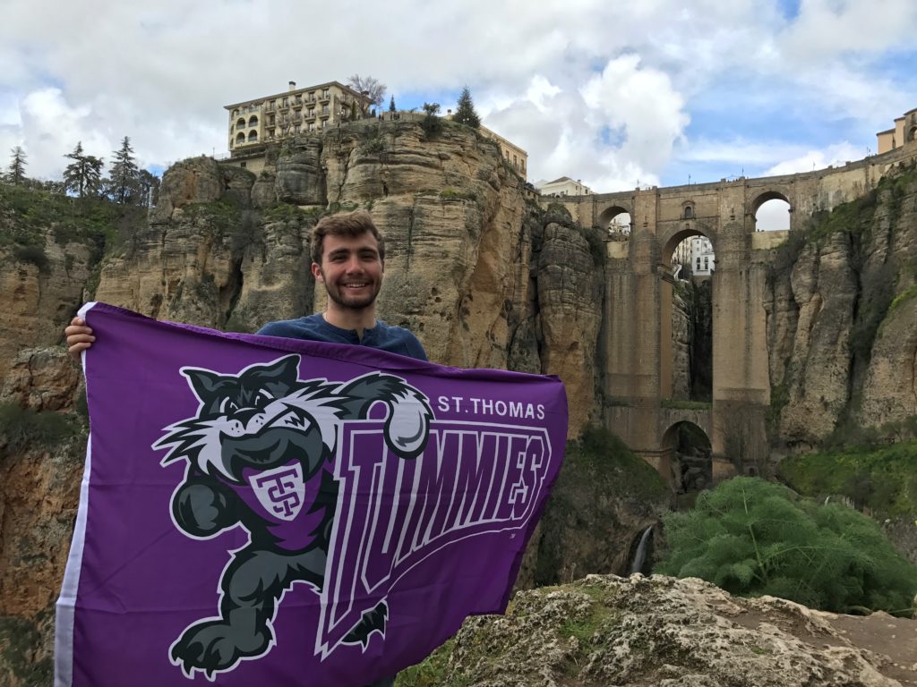 y Cullen Hilliker This photo is taken in Ronda, Spain. Ronda is a small city located in Southern Spain (surrounded by beautiful terrain and countless olive trees). It is my favorite Spanish city because of its beauty. Pictured behind me is a 322-foot bridge that joins the city.