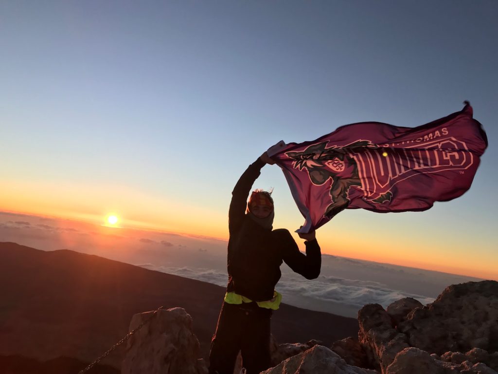 This photo was taken at the top of Mount Teide, a 12,000-foot volcano in Tenerife, Spain. Behind me is the sunrise over the clouds. The hike started at 11:00 PM and we reached the top just as the sun began to rise at 7:30 AM. I couldn’t help but show my Tommie pride in this setting! After appreciating the beauty from on top of the mountain, I hiked back down and finished around 1:30 PM. This was one of my favorite hikes I have ever completed.