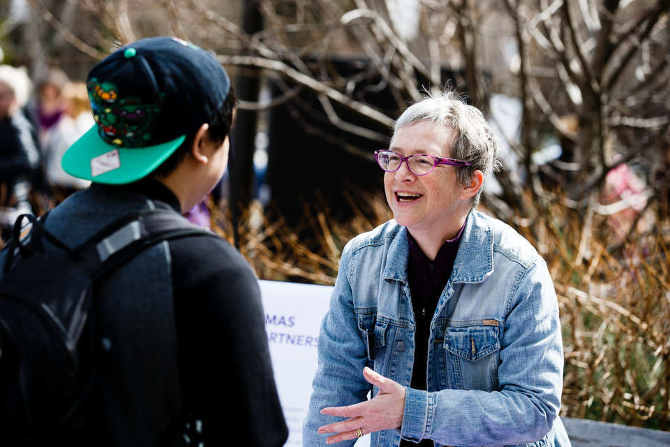 Elise Amel from the Office of Sustainability Initiatives speaks to a student during an event to celebrate St. Thomas' new status as an Ashoka Changemaker Campus April 4, 2017 on the John P. Monahan Plaza. Ashoka U is a global consortium working to inspire a culture of social innovation in higher education. St. Thomas became the first in Minnesota and the 40th Changemaker Campus in the consortium