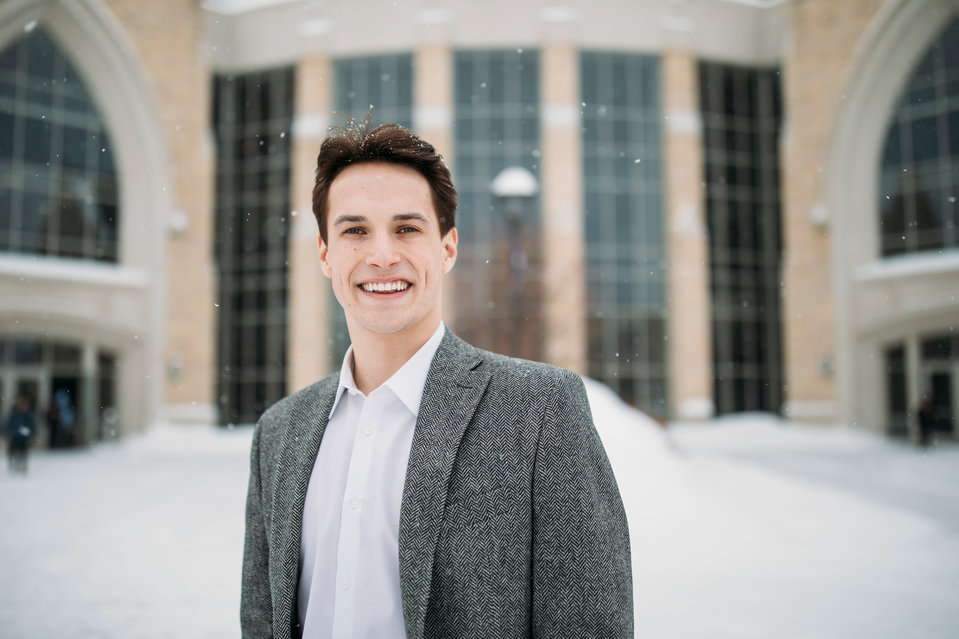 Business major Jacob DeMille poses for a portrait on a snowy day in front of the Anderson Student Center on February 20, 2019 in St. Paul. DeMille was photographed for the Humans of St. Thomas series.