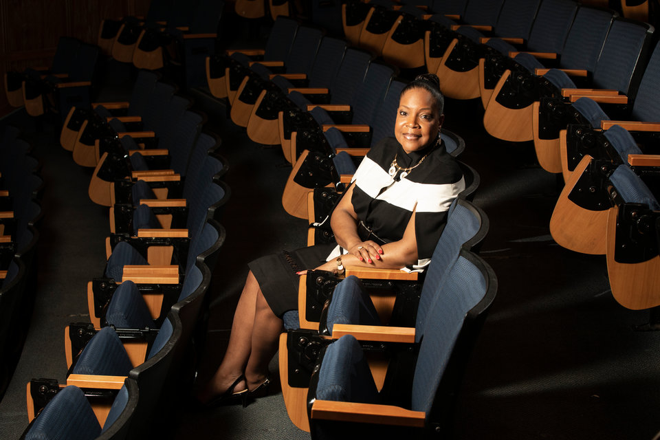 Cynthia Fraction, Director of the EXCEL! Research Scholars Program, poses for a portrait in the JRC Auditorium.