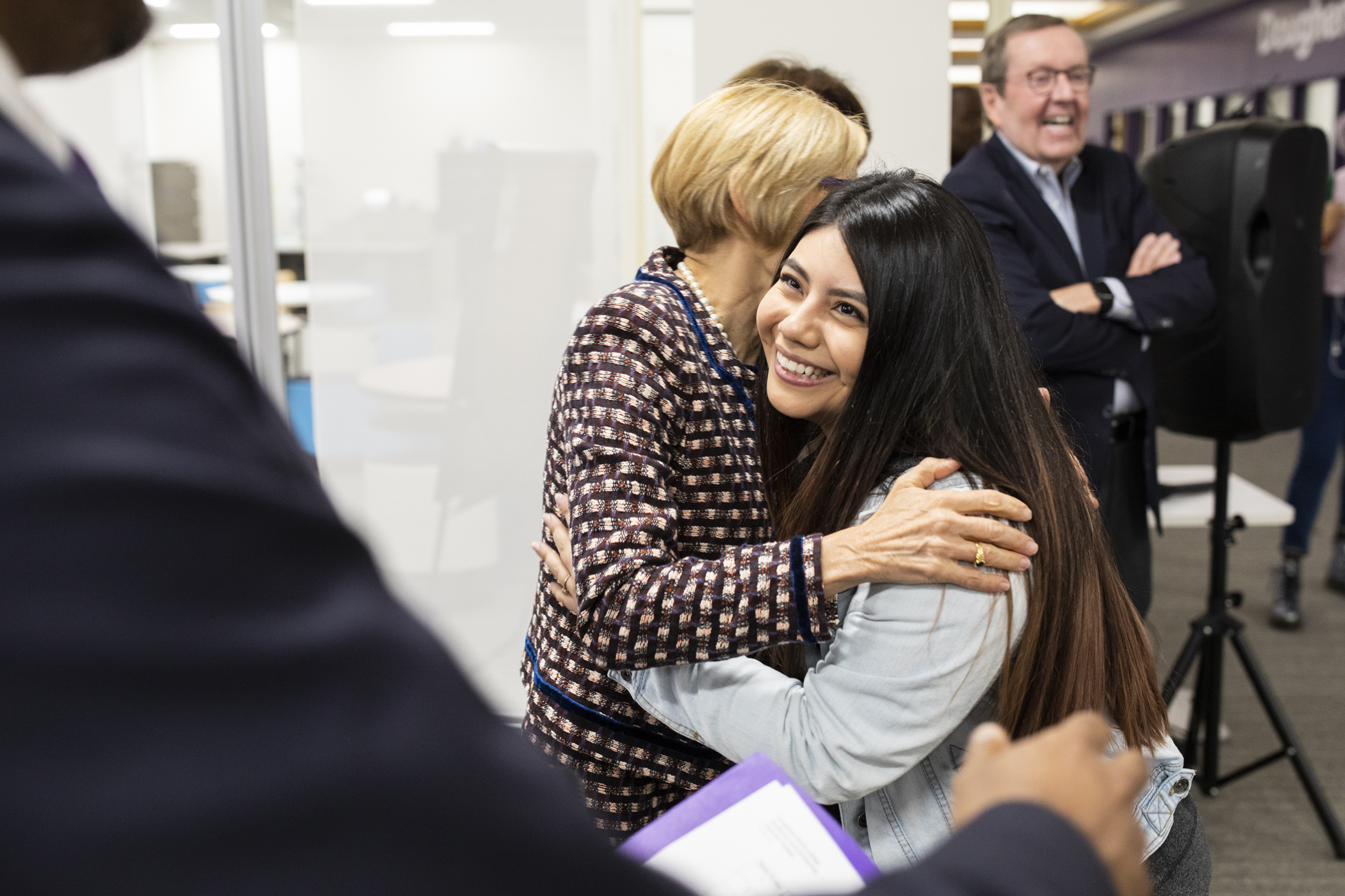 Andrea Mina Rodriguez hugs President Julie Sullivan after being named a recipient of a full tuition scholarship to pursue her bachelor's degree at St. Thomas.