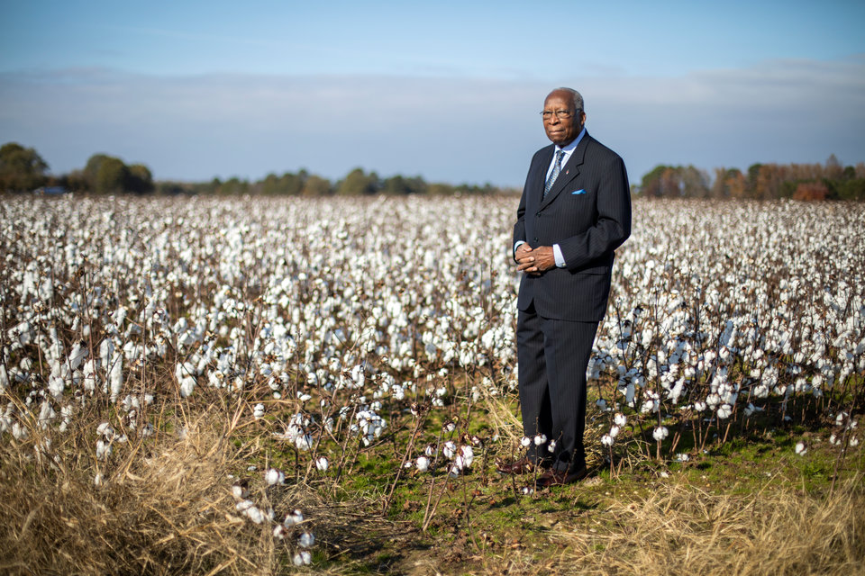 Steve Bullock stands amongst unharvested cotton plants outside of his hometown of Enfield, North Carolina on November 23, 2018. Steve can remember his humble beginnings as a shoeless child, picking the same crop by hand while working on his family's farm. Steve Bullock was photographed for a feature story in St. Thomas Magazine.