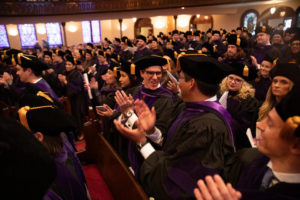 Students celebrate at the conclusion of the 2019 School of Law Commencement Ceremony at Westminster Presbyterian Church in Minneapolis on May 18, 2019.