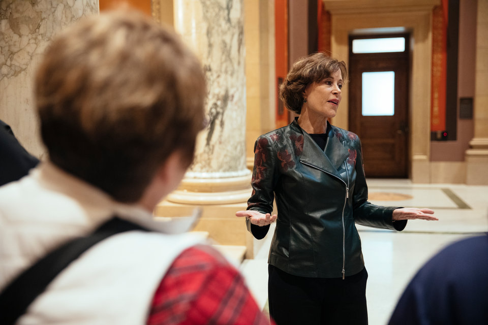 Former Minnesota legistator and Minnesota Supreme Court Chief Justice Kathleen Blatz talks with a tour group in the Minnesota State Capitol Building in St. Paul on March 11, 2019.