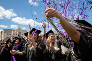 Confetti flies over the heads of students during the undergraduate ceremony on May 25.