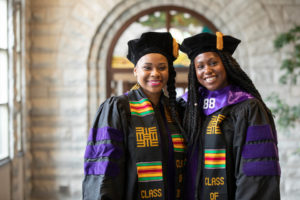 Two graduating students pose for a portrait during the 2019 School of Law Commencement Ceremony at Westminster Presbyterian Church in Minneapolis on May 18, 2019.
