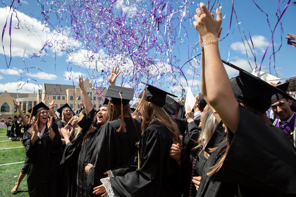 Graduates celebrate as confetti falls around them during the 2019 Undergraduate Commencement Ceremony in the O’Shaughnessy Stadium on May 25, 2019 in St. Paul.