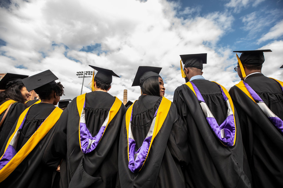 Students await the calling of their names during the 2019 Graduate Commencement Ceremony in O’Shaughnessy Stadium on May 25, 2019 in St. Paul.