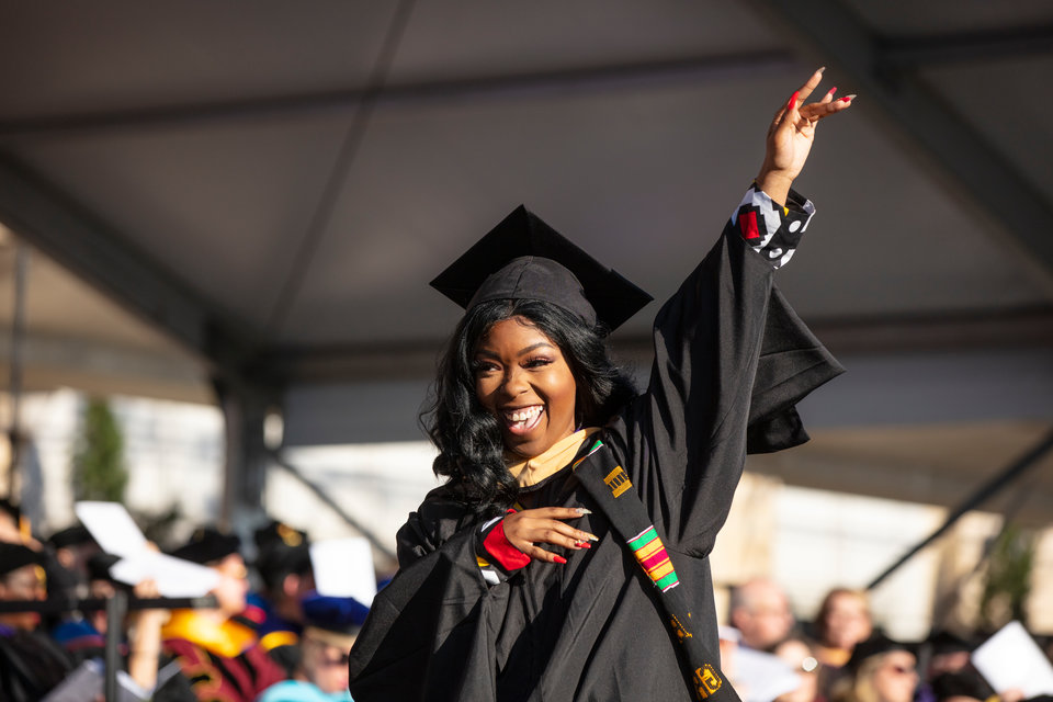 A student celebrates during the 2019 Graduate Commencement Ceremony in O’Shaughnessy Stadium on May 25, 2019 in St. Paul.