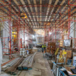 Construction crews work in the Chapel of St. Thomas Aquinas during renovations.