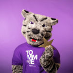 Tommie the mascot poses for photos in the studio